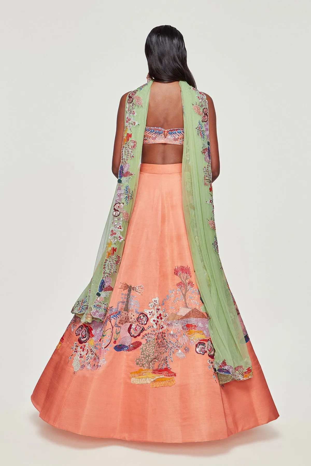 Peach Divergence Silk Appliquéd and Embellished Lehenga With Blouse And Cutwork Tulle Dupatta