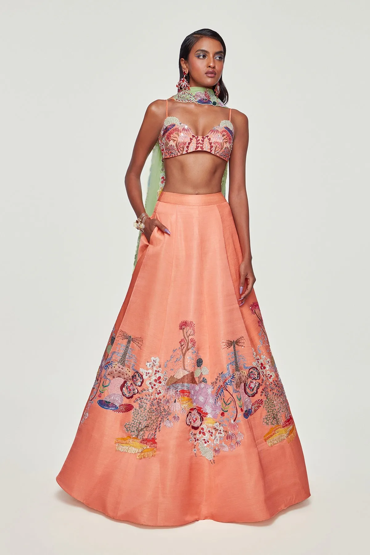Peach Divergence Silk Appliquéd and Embellished Lehenga With Blouse And Cutwork Tulle Dupatta