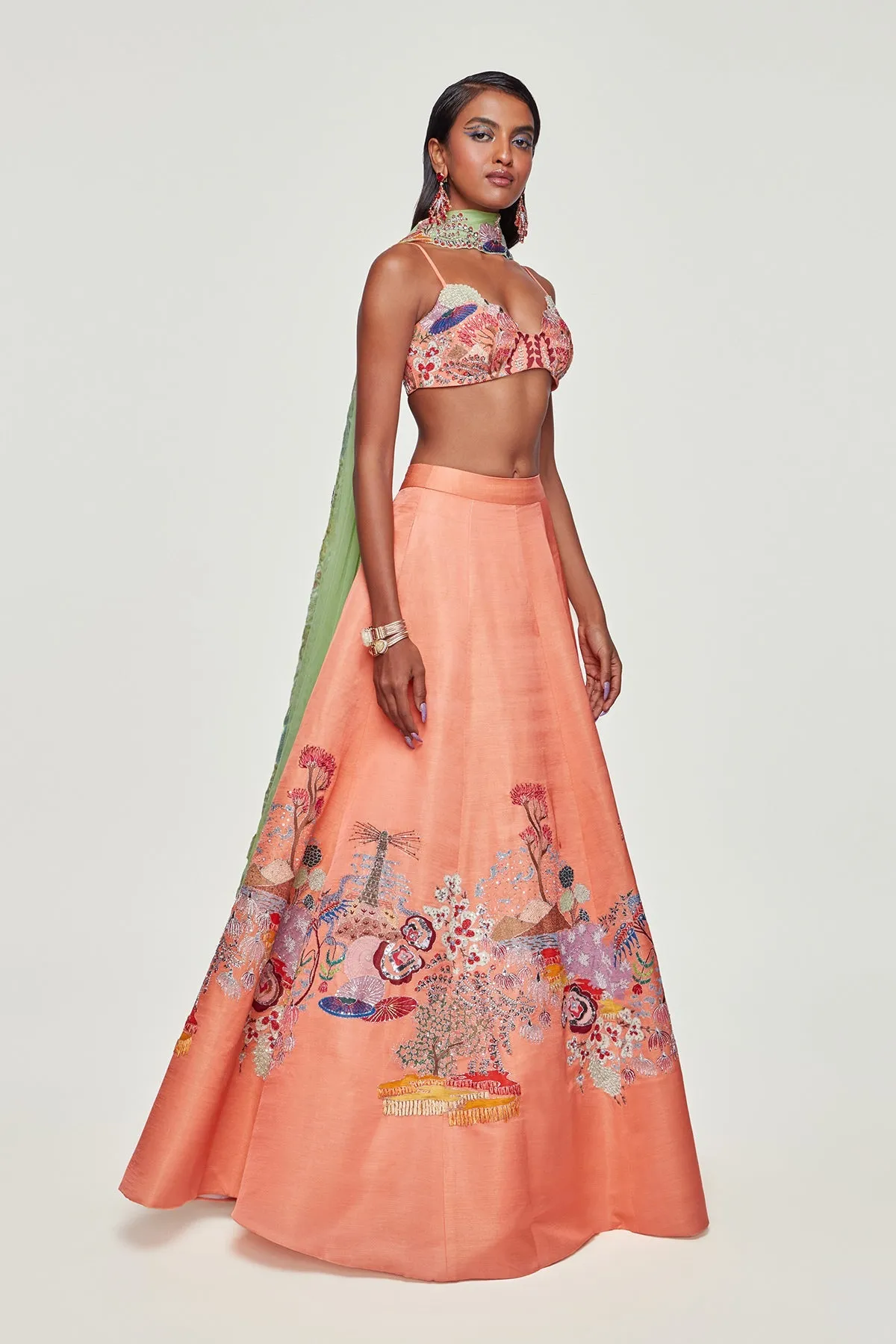 Peach Divergence Silk Appliquéd and Embellished Lehenga With Blouse And Cutwork Tulle Dupatta