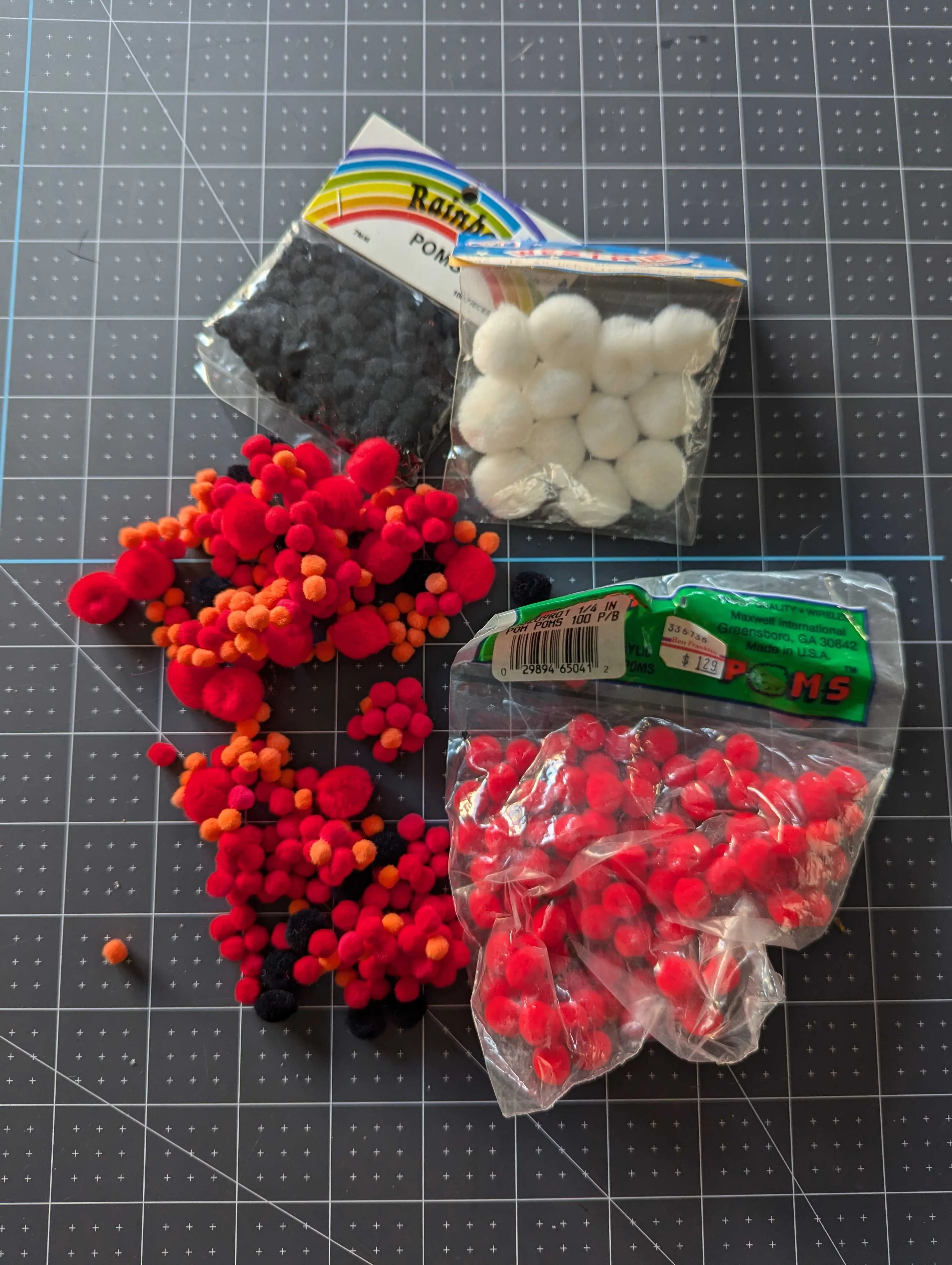 Red, Black, Orange and White Multi Size Pom Pom Assortment