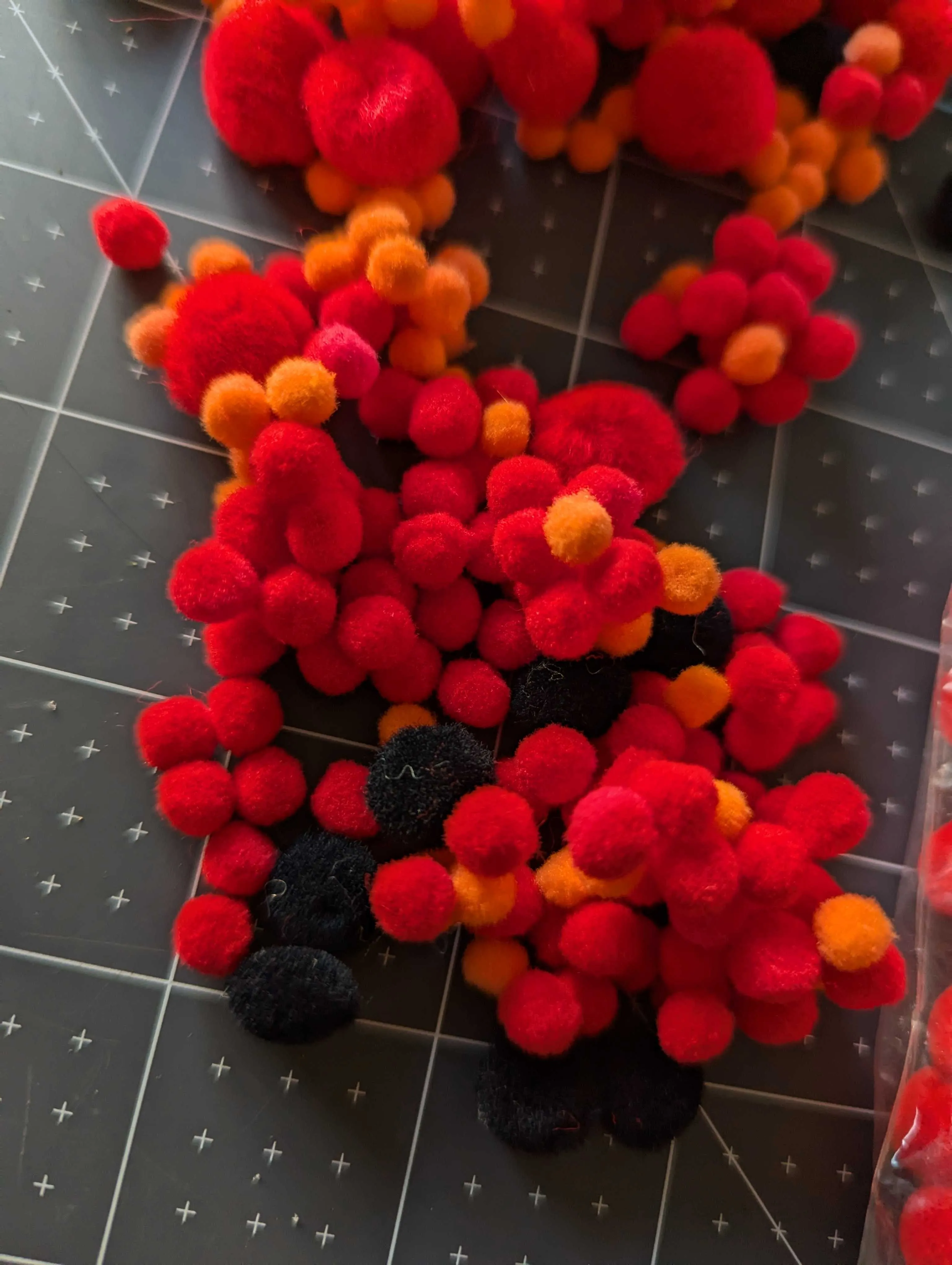 Red, Black, Orange and White Multi Size Pom Pom Assortment