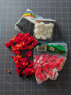 Red, Black, Orange and White Multi Size Pom Pom Assortment